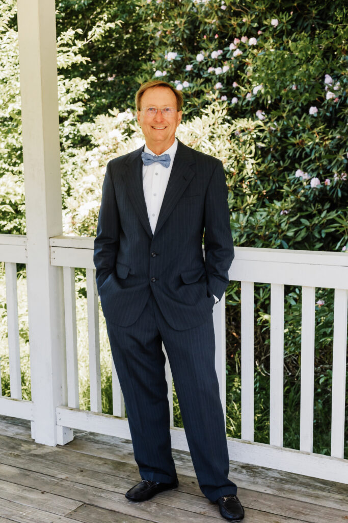 Man in suit under a gazebo