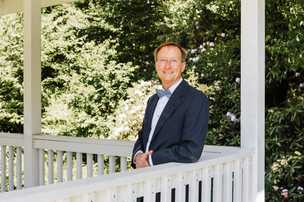 Man in suit under a gazebo