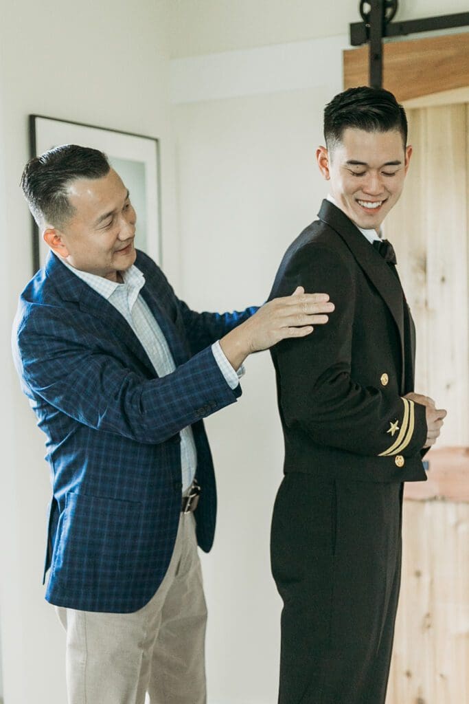 Dad helping groom getting ready for his wedding day.
