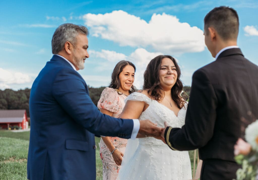 Dad giving bride away to the groom on their elopement day