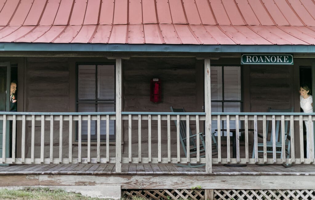 Couple getting married under gazebo eloping in front of the mountains with their son.