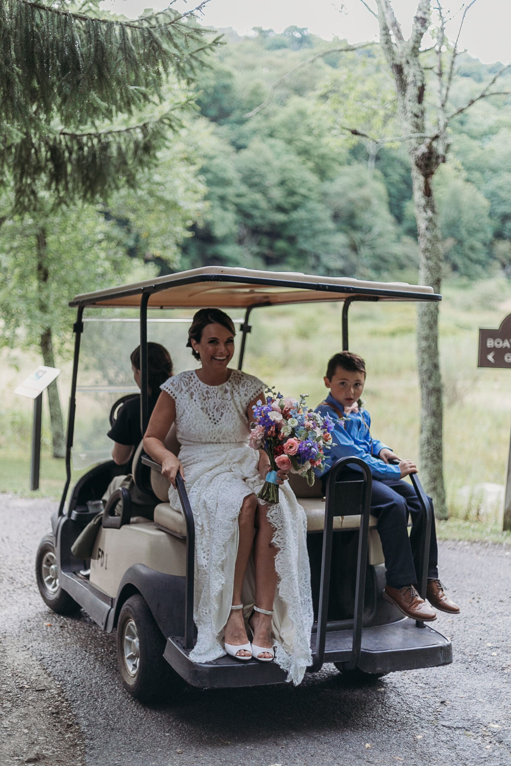 Couple getting married under gazebo eloping in front of the mountains with their son.